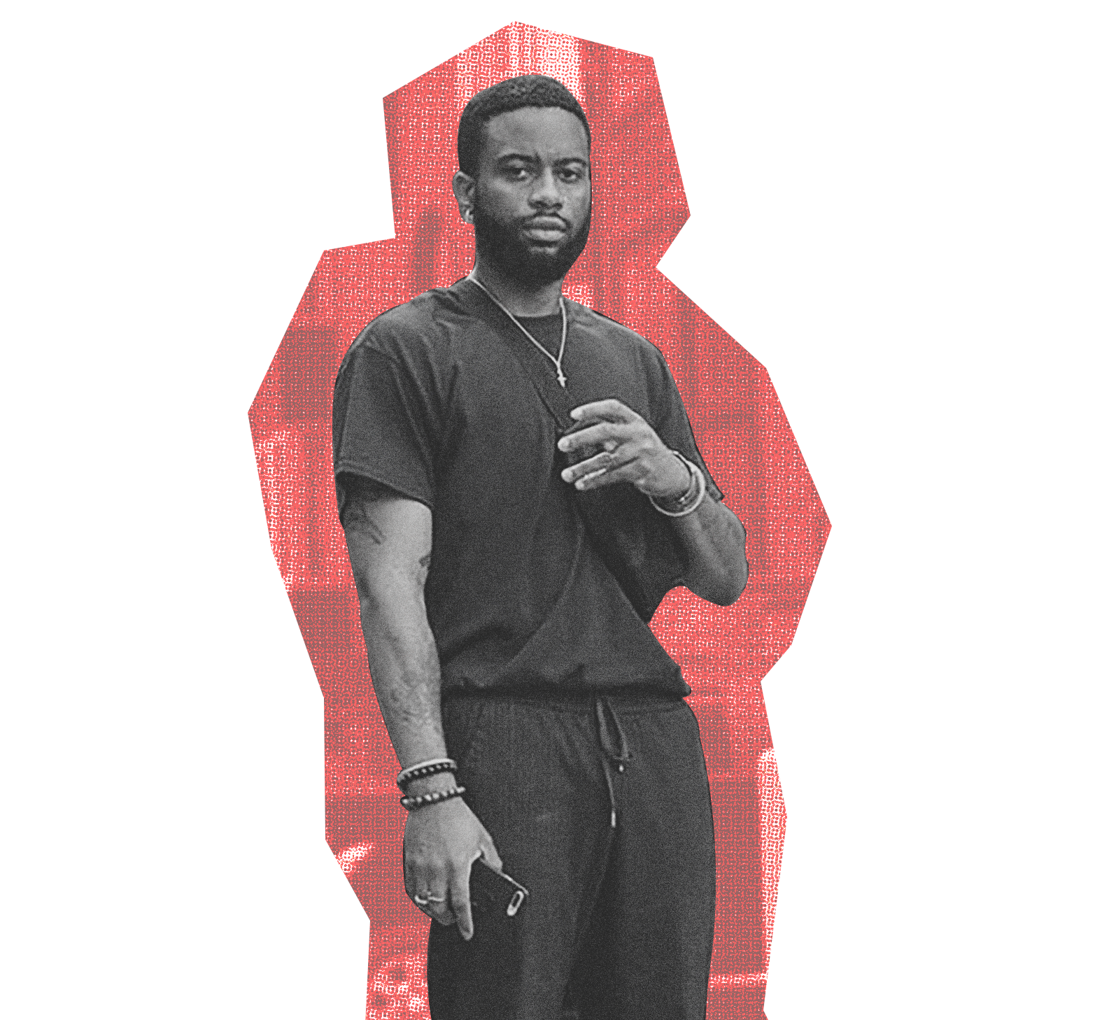 a dark-skinned individual in a black t-shirt and pants holding a cellphone to their chest